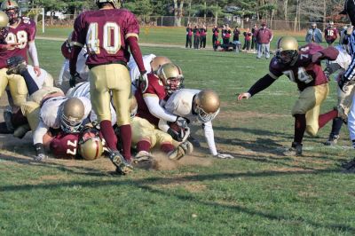 Cougar Classic
Junior Tyler Steek (#40) and senior Tyler Guilbeault (#74) arrive too late to take down one of Tri-County's players during the big "Cougar Classic" game held on November 22 at Old Colony Regional Voke which ended in a heart-breaking shutout, 21-0. (Photo by Robert Chiarito).
