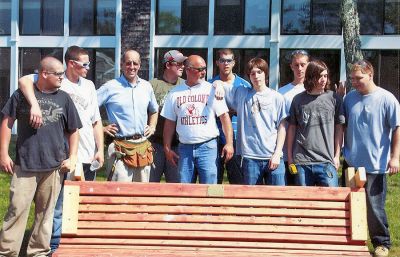 Bench Mark
Eight students from Old Colony Regional Vocational Technical High School in Rochester recently constructed and installed three new benches on the Village Court property in Mattapoisett. Working diligently under the direction of OCR instructors, the students dug holes and firmly anchored the benches on the premises in 90-degree heat. Mahoney Builders donated the lumber for the project and a plaque on each bench reads: Donated by Old Colony RVTHS and Mahoney Builders. (Photo courtesy of Joyce Gagne).

