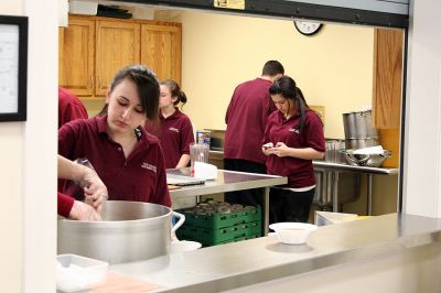 Cooking Class
Members of the Old Colony Regional Vocational Technical High School Culinary Arts Program recently served one of their monthly luncheons to residents at the Rochester Senior Center. Under the supervision of program director Scott Botelho, the students took over the kitchen at the Senior Center to share their cooking talents and prepare some Venus De Milo style soup and meatball subs. (Photo by Robert Chiarito).
