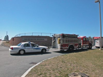 ORR Bomb Scare
Units from the Marion Police and Fire Department guard the side entrance to Old Rochester Regional High School during a bomb threat which forced the evacuation of the school on Monday morning, April 9. Students were bused to Tabor Academy in nearby Marion while the threat was investigated. (Photo by Kenneth J. Souza).
