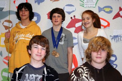 Making Waves
Five of the students who helped create the Save the Bay display inside the entrance to ORR Junior High School are shown in front of the display. Front row, left to right: Andrew Cardwell and David Dalton. Back row, left to right: Evan Botello, Max Medina, Michaela Riggi. (Photo by Sarah Taylor)
