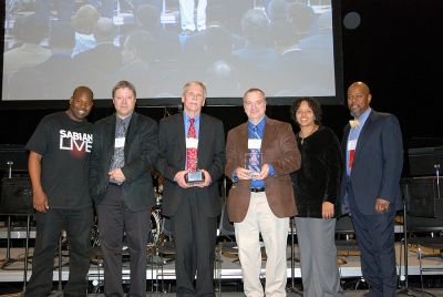 ORR Music Winners
(l. to r.) Drummer and Berklee alumnus John Blackwell, Fryeburg Academy Music Director C. Brent LaCasce, Old Rochester Regional High School Music Director Stan Ellis, Milton Academy Music Director Bob Sinicrope, Percussion Professor Terri Lynne Carrington and Music Education Chair Cecil Adderley pose at Berklee's Annual High School Music Festival.

