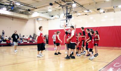March Madness
Old Rochester Regional Junior High School hosted March Madness Junior, a benefit basketball game on Friday evening, March 14, which pitted the students and faculty against each another. The game, which was organized to benefit the Thuestad family of Mattapoisett and the DeMello family of Rochester, ended with the students narrowly defeating the faculty, 48-47. (Photo by Robert Chiarito).
