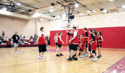 March Madness
Old Rochester Regional Junior High School hosted March Madness Junior, a benefit basketball game on Friday evening, March 14, which pitted the students and faculty against each another. The game, which was organized to benefit the Thuestad family of Mattapoisett and the DeMello family of Rochester, ended with the students narrowly defeating the faculty, 48-47. (Photo by Robert Chiarito).
