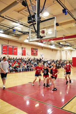 March Madness
Old Rochester Regional Junior High School hosted March Madness Junior, a benefit basketball game on Friday evening, March 14, which pitted the students and faculty against each another. The game, which was organized to benefit the Thuestad family of Mattapoisett and the DeMello family of Rochester, ended with the students narrowly defeating the faculty, 48-47. (Photo by Robert Chiarito).
