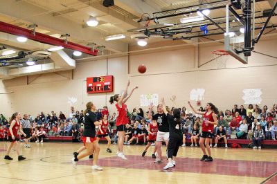 March Madness
Old Rochester Regional Junior High School hosted March Madness Junior, a benefit basketball game on Friday evening, March 14, which pitted the students and faculty against each another. The game, which was organized to benefit the Thuestad family of Mattapoisett and the DeMello family of Rochester, ended with the students narrowly defeating the faculty, 48-47. (Photo by Robert Chiarito).
