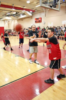 March Madness
Old Rochester Regional Junior High School hosted March Madness Junior, a benefit basketball game on Friday evening, March 14, which pitted the students and faculty against each another. The game, which was organized to benefit the Thuestad family of Mattapoisett and the DeMello family of Rochester, ended with the students narrowly defeating the faculty, 48-47. (Photo by Robert Chiarito).
