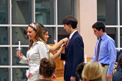 Honor Students Inducted
Old Rochester Regional High School National Honor Society recipients (l. to r.) Sarah Jennings, Tucker Johnson and Toby Maak light candles and receive their commemorative pins at the ORR Induction Ceremony held on March 1. The trio was among 45 students who were inducted into ORR NHS Chapter. (Photo courtesy of Jane McCarthy).
