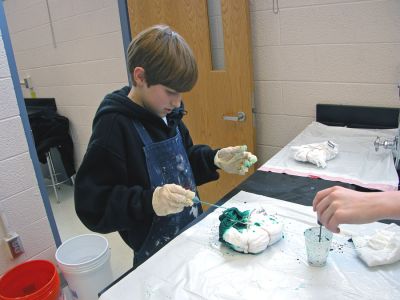 Tie-Dyed at ORR
Students in Ms. Gauvins eighth grade science class at Old Rochester Regional Junior High School learned about chemical reactions and colors during a tie-dye shirt-making session held this past week. UMass Dartmouth Chemistry Professor Tobey Dills (right background) and members of the UMass Dartmouth Chemistry Club were on hand to supervise the proceedings. Each student made their own cotton tie-dyed shirt which they will wear to school as part of a planned Tie-Dyed Day. (Photo by Kenneth J. Souza).
