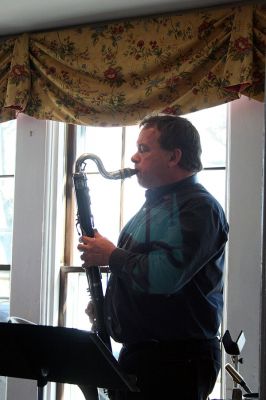 Poetic Jazz
Ellen Flynn and members of the Friends of the Mattapoisett Library welcomed poet Franklin D. Reeve to the Kinsale Inn in Mattapoisett on Sunday April 5 as part of the library's celebration of National Poetry Month. Mr. Reeve performed his piece, The Blue Cat Walks the Earth, accompianied by improvisational jazz muscians Don Davis and Joe Deleault in a performance dedicated to the memory of the late Library Director Judy Wallace. (Photo by Robert Chiarito)
