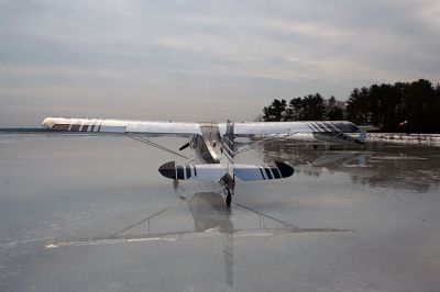 Frozen Flyers
A group of South Coast pilots recently took advantage of this winter's cold conditions to use Snipatuit Pond as a landing strip. The pilots use charts provided by the United States Government to determine if the thickness of the iceis enough tosupport the weight of their airplanes. Pilot Ben Bailey, who lives on the shores of the pond and hosted this past week's get together, flies a seaplane off of the pond during warmer weather months. (Photo by Robert Chiarito).
