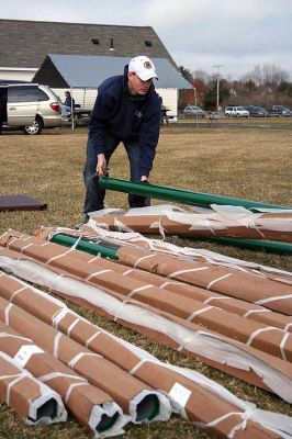 Playground Pals
An Army of volunteers descended on the Dexter Lane Sports Complex on Saturday, March 28 to build a much anticipated playground for the town of Rochester. The project is the result of a community wide fundraising effort spearheaded by Craig Davignon's 4th grade class at Rochester Memorial School over the last several years. (Photo by Robert Chiarito)
