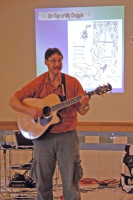 Poetry in Mattapoisett
Jeff Nathan, an award-winning childrens author and creator of PunOETRY, sings at Mattapoisetts Center School on Tuesday, January 9 during one of three assemblies for K-3 students. Mr. Nathans appearance at the school was supported, in part, by a grant from the Mattapoisett Cultural Council, a local agency which is supported by the Massachusetts Cultural Council, a state agency. (Photo by Kenneth J. Souza).
