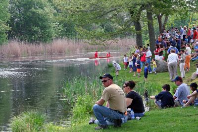 Spectator Sport
The crowd watches from the banks along the Mattapoisett River as two-member teams make their way to the finish line at the Herring Weir on Route 6 during the 2007 Memorial Day Boat Race. (Photo by Robert Chiarito).
