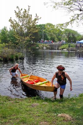 Women Winners
Kate Hartley of Rochester and Amy Hartley-Matteson of Mattapoisett (Team #21) remove their boat from the water after crossing the finish line and taking first place in the Women's Division in the 2007 Memorial Day Boat Race on the Mattapoisett River. (Photo by Robert Chiarito).
