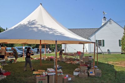 Book Bargains
Book lovers had a chance to find a good read or two as the Friends of the Joseph Plumb Memorial Library in Rochester held their annual book sale under a tent on the librarys lawn on Saturday, September 8. Bargain hunters have been flocking to this event for years in search of the perfect book and this sale was no exception with shoppers arriving bright and early to get the first crack at box upon box of reading pleasures all priced at $2 or less. (Photo by Robert Chiarito).
