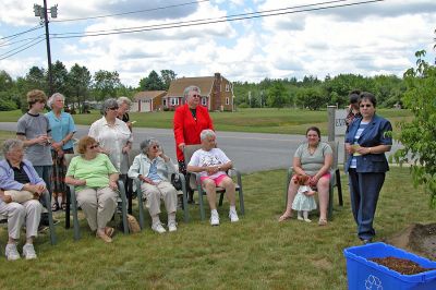 COA Memorial Tree Planting
Rochester Council on Aging (COA) Director Sharon Lally remembers former COA Custodian Paul Ouellette and dedicates a memorial tree in his honor while Mr. Ouellette's family looks on. (Photo by Kenneth J. Souza).
