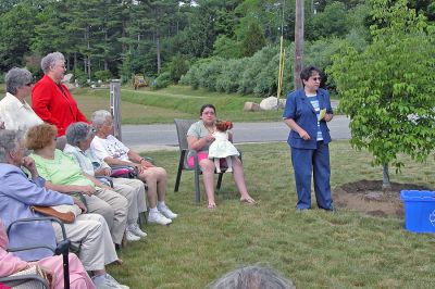 COA Memorial Tree Planting
Rochester Council on Aging (COA) Director Sharon Lally remembers former COA Custodian Paul Ouellette and dedicates a memorial tree in his honor while Mr. Ouellette's family looks on. (Photo by Kenneth J. Souza).
