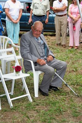 Church Donation
George Church looks at the empty seat holding a flower to symbolize his late wife Katherine during a ceremony on Sunday, August 26 honoring the couple for their years of service and commitment to the Town of Rochester. The Rochester Land Trust dedicated a wildlife preservation area in the couple's name. (Photo by Robert Chiarito).
