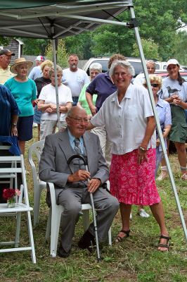Church Donation
George Church (seated) poses with Susan Adams of the Rochester Land Trust during a ceremony honoring Mr. Church and his late wife Katherine for their years of service and commitment to the Town of Rochester by dedicating a wildlife preservation area in the couple's name. (Photo by Robert Chiarito).
