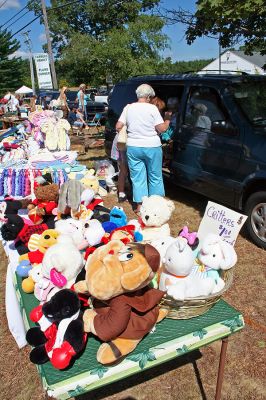 Bargain Hunting
The First Congregational Church of Rochester held their 34th Annual Flea Market held on the town green on Saturday, September 1. There was a little something for everyone at the fundraiser as shoppers meandered from booth to booth carrying the days bargains and purchases. (Photo by Robert Chairito).

