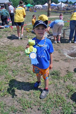 Frog Champ
The winner in the "large" category of the Frog Derby during the 2007 Rochester Country Fair proudly displays his prize. (Photo by Robert Chiarito).
