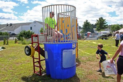 Policeman Plunge
Rochester Police Officer William Chamberlain prepares to take on challengers in the dunk tank during the 2007 Rochester Country Fair. (Photo by Robert Chiarito).
