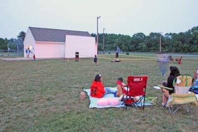 Drive-In Benefit
A benefit Drive-In Movie Fundraiser was held on Saturday night, June 14 at the Dexter Lane Ballfield in Rochester. The special outdoor screening of Disney's movie "Cars" was to benefit the new playground for kids at Dexter Lane. (Photo by Robert Chiarito).


