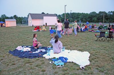 Drive-In Benefit
A benefit Drive-In Movie Fundraiser was held on Saturday night, June 14 at the Dexter Lane Ballfield in Rochester. The special outdoor screening of Disney's movie "Cars" was to benefit the new playground for kids at Dexter Lane. (Photo by Robert Chiarito).


