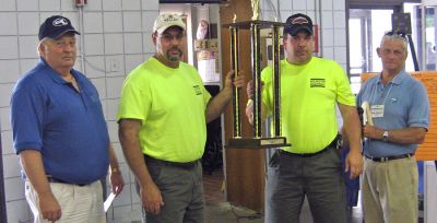 'Roadeo' Champs
Bob Lake (second from left) and Bob Laferriere (second from right) of the Rochester Highway Department accept their trophy as the first place winners in the Massachusetts Highway Associations Snow Plow Roadeo State Finals. Dave Capelle (left), President of the Massachusetts Highway Association, and Frank Cheverie, MHA Rodeo Chairman, (right), presented the winning trophy during the recent 28th annual New England Public Works Expo. Rochesters winning team represented Plymouth County in the state finals.
