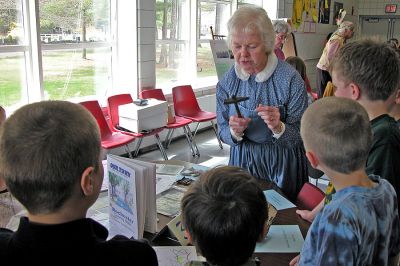 History Lessons
Volunteer members of the Rochester Historical Society presented a diverse program about the town's rich history to members of the Grade 3 classes at Memorial School on Monday, April 30. Among the various topics covered were the first Native American settlers, how early Rochester residents dressed and ate, and what type of games and pasttimes former residents enjoyed. (Photo by Kenneth J. Souza).
