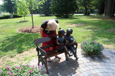 Reading Garden
The Joseph H. Plumb Memorial Library in Rochester recently dedicated a new Reading Garden, an outdoor sculpture garden and sitting area, that was a gift of the family and friends of Steven Santos in his memory on Saturday morning, June 28. (Photo by Robert Chiarito).
