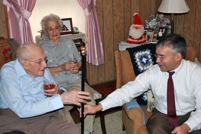 Citizen Cane
Ninety-eight-year-old Chester "Chet" Rollins of Rochester, seen here with his wife Marjorie, accepts the Boston Post cane as the town's oldest living citizen from Selectmen Chairman Richard Nunes during a presentation ceremony at his home on Friday, December 19. (Photo by Kenneth J. Souza).
