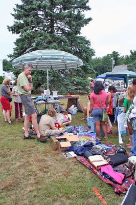 Rochester Rummage
The First Congregational Church of Rochester held their annual outdoor Rummage Sale on the Town Green in Rochester Center on Saturday, August 30. The event drew a sizeable crowd of potential customers looking for great items at bargain prices. (Photo by Robert Chiarito).
