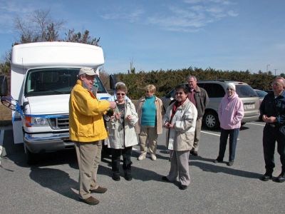 Rochester's New Wheels
Town officials and members of the Rochester Council on Aging (COA) Board of Directors poured non-alcoholic champagne over the hood of the newly-dedicated COA minibus which the town acquired through a rebate they received from MBTA funds during a dedication ceremony held on Friday, March 30. The new 14-passenger vehicle can also accommodate two wheelchairs and will be used to transport seniors to various events. (Photo by Kenneth J. Souza).
