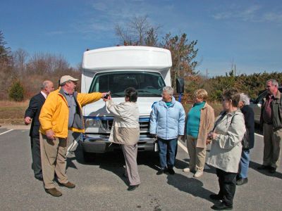 Rochester's New Wheels
Town officials and members of the Rochester Council on Aging (COA) Board of Directors poured non-alcoholic champagne over the hood of the newly-dedicated COA minibus which the town acquired through a rebate they received from MBTA funds during a dedication ceremony held on Friday, March 30. The new 14-passenger vehicle can also accommodate two wheelchairs and will be used to transport seniors to various events. (Photo by Kenneth J. Souza).
