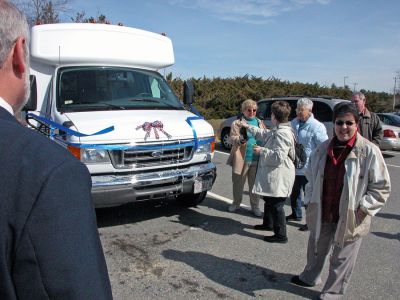 Rochester's New Wheels
Town officials and members of the Rochester Council on Aging (COA) Board of Directors poured non-alcoholic champagne over the hood of the newly-dedicated COA minibus which the town acquired through a rebate they received from MBTA funds during a dedication ceremony held on Friday, March 30. The new 14-passenger vehicle can also accommodate two wheelchairs and will be used to transport seniors to various events. (Photo by Kenneth J. Souza).

