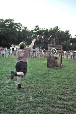 Wood, If I Could
The ever-popular Woodsman Show remains a highlight of Rochesters annual Country Fair and was held on Friday evening, August 22. Here a contestant displays his skills at the difficult and sometimes dangerous axe-throwing competition. Other events included log rolling, bow sawing, disc stacking, spring board chop, two-person cross cut, chainsaw cutting, and downward chop. Some of the woodmen came from as far away as Vermont to compete in this years program. (Photo by Robert Chiarito).

