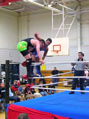 Ringside in Rochester
Members of the Northeast Championship Wrestling League (NCW) held a series of wrestling matchups in the gymnasium of Rochesters Memorial School on Saturday, April 14 on the occasion of their tenth anniversary to stage a Reunion of NCW to benefit the family of RMS science teacher Tom Kinsky. Mr. Kinsky and his family lost their Wareham home to fire on the night of February 25, which left the family in need of virtually all necessities. (Photo by Robert Chiarito).
