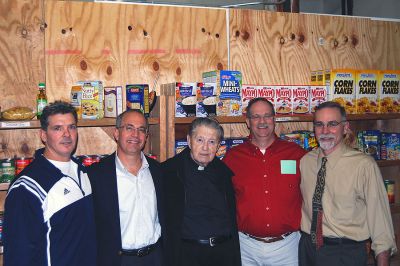 Running to Give
The Rochester Road Race Board recently presented a check for $3,000 to Father Gabriel Healy, Co-Director and Treasurer of Damiens Food Pantry in Wareham. Pictured, from left are board members Travis Van Hall and Chuck Kantner; Father Gabriel Healy, Co-Director of Damiens Pantry; and board members Scott Muller and Kevin Cassidy. 
