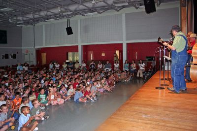 Resonators in Rochester
The student body of Rochester Memorial School received a gift from the schools Parents-Teachers Organization (PTO) to mark the beginning of the school year on Friday, September 7 in the form of a concert by local favorites The Resonators. The band played two shows of what they bill as a Slice of Americana in the schools cafeteria to accommodate the entire school population. (Photo by Robert Chiarito).
