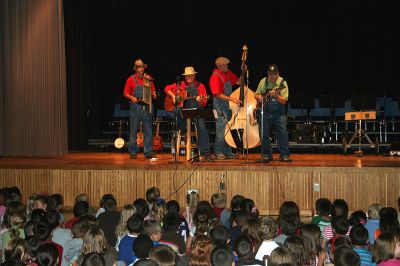 Resonators in Rochester
The student body of Rochester Memorial School received a gift from the schools Parents-Teachers Organization (PTO) to mark the beginning of the school year on Friday, September 7 in the form of a concert by local favorites The Resonators. The band played two shows of what they bill as a Slice of Americana in the schools cafeteria to accommodate the entire school population. (Photo by Robert Chiarito).
