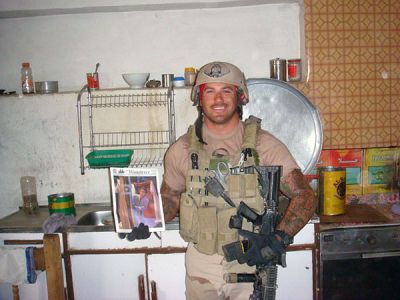 Call of Duty
Mattapoisett native and current San Diego resident Rick Cote poses with a copy of The Wanderer in Iraq where he is stationed as a Navy Explosive/Ordinance Expert. This picture was taken in a house that troops temporarily occupied during a mission. (Photo courtesy of Nolan LeRoy).

