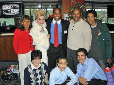 Camp Crew
Ron Burton Training Village Campers and Board Members who recently celebrated their annual Christmas Party at the EMC Club at Fenway Park included (l. to r.) Joanne Burton; Yolanda Cellucci; Paul Burtonr; Ron Burton, Jr.; Sam West, Camper; kneeling: Joanne Byron, Camp Tennis Director; and campers Malakai Pearson and Jeffrey West.
