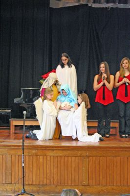 Seasonal Singing
Local favorites The Showstoppers performed Christmas classics during their Holiday Concert on Sunday, December 23 at the Marion Music Hall. (Photo by Robert Chiarito).
