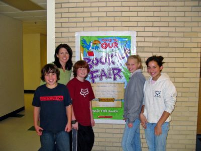 Sippican School Book Fair
Sippican School in Marion held its third annual book fair to benefit the sixth grade class and their upcoming spring trip to the White Mountains in New Hampshire, known as The Wilderness Classroom. Aimee Fox, a coordinator for the activity fund (pictured here with students), helped to organize the book fair with the help of 35 parent volunteers. (Photo by Nancy MacKenzie).
