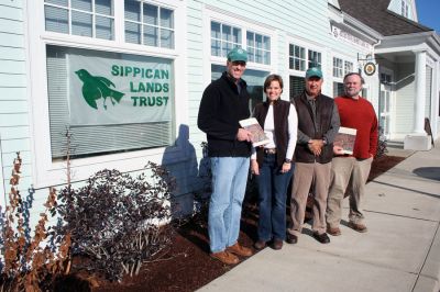 Sippican Signing
Author and Sippican Lands Trust (SLT) member Peter C. Stone recently signed copies of his book, The Untouchable Tree, as a benefit for the SLT at their offices in the Pilgrim Bank Plaza at 354 Front Street in Marion. Pictured here, from left, are Stone, SLT Executive Director Jessica Whittaker, SLT member Allan Ditchfield, and SLT President Chris Bryant. (Photo by Robert Chiarito).
