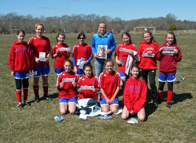 Kick It Out
Stacey Bishop of the Boston Breakers soccer club poses with members of the Mariners Youth Soccer team and a copy of the Wandererthis past weekend in Fairhaven. Pictured are; Back row: L  R: Syd Blanchard, Morgan Browning, Kristen Fuller, Caroline Downey Stacey Bishop, Nicole Gifford, Camille Filloramo and Emily Beaulieu. Front Row L  R: Bailey Truesdale, Arden Goguen, Kaleigh Goulart and Sam Blanchard.
