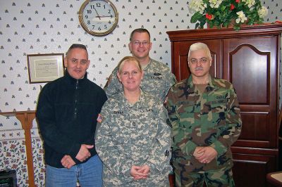 Soldier Returns Home
(back) Sergeant First Class James Vible, (front, l. to r.) Staff Sergeant Peter DeMedeiros, Sergeant First Class Dianne Chase, and Staff Sergeant Antone Mello recently returned from Iraq to pay a visit with residents of Winslow Gardens and Linn Health Care Center, United Methodist Elder Care Communities in East Providence, RI. SSG Antone Mello is a resident of Marion.
