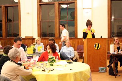 What's the Buzz?
Mistress of Ceremonies Jenni Strand defines a word during the Second Annual Lizzie Ts Spelling Bee to benefit Marions Elizabeth Taber Library on Thursday, March 6 at the Marion Music Hall. Eleven teams of three members each competed in three rounds for the title of "Best Spellers." (Photo by Kenneth J. Souza).
